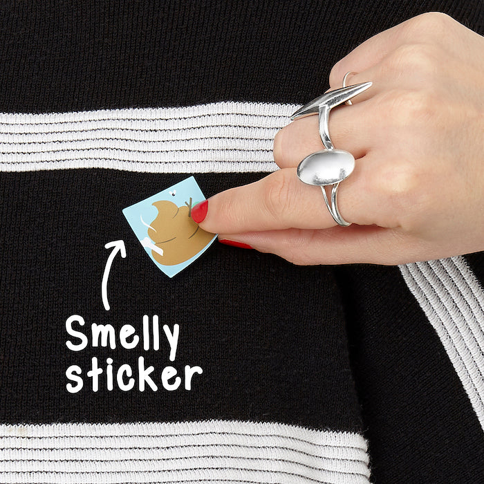 A person placing a smelly sticker on clothes