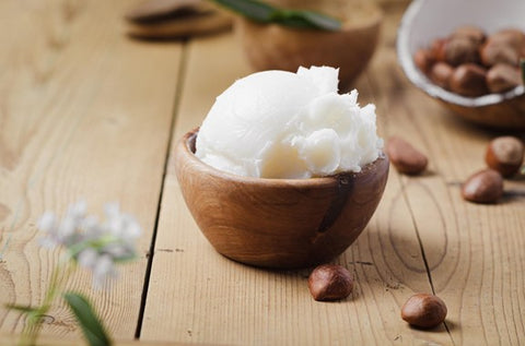 shea butter moisturiser in a wooden bowl