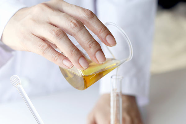 Hand pouring concentrated formulation from a beaker