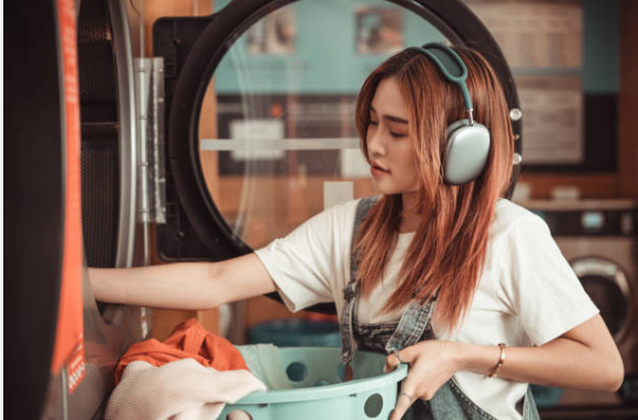 Woman cleaning listening to music