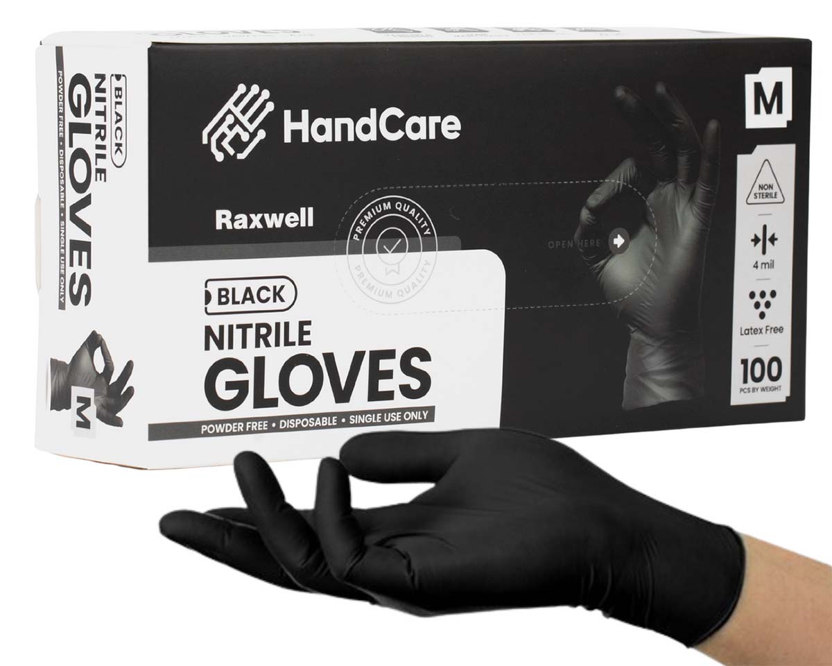 A box of HandCare black nitrile gloves with an outstretched hand beneath it.