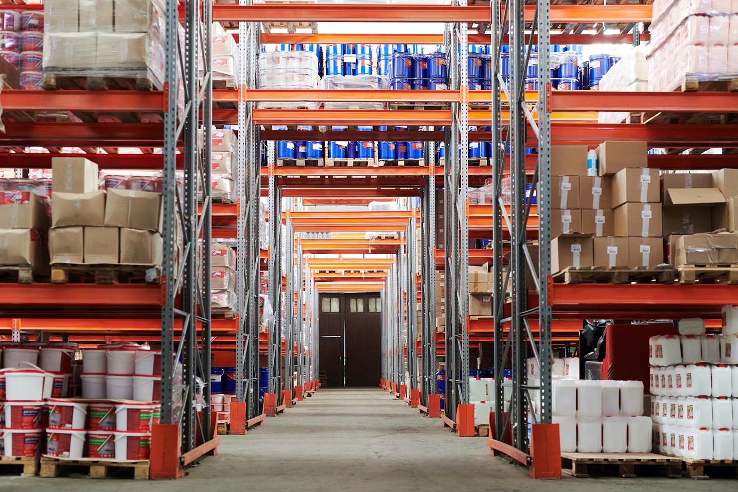 aisle of a warehouse filled with boxes