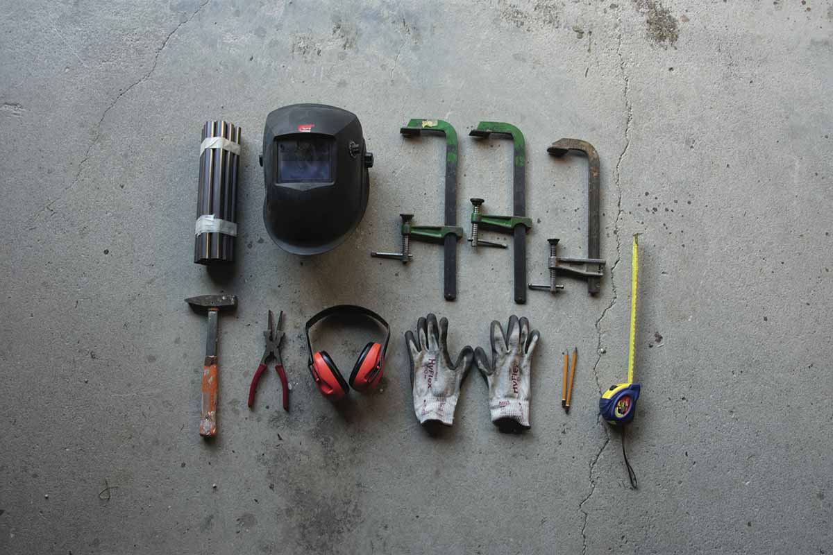 tools spread out on a concrete floor