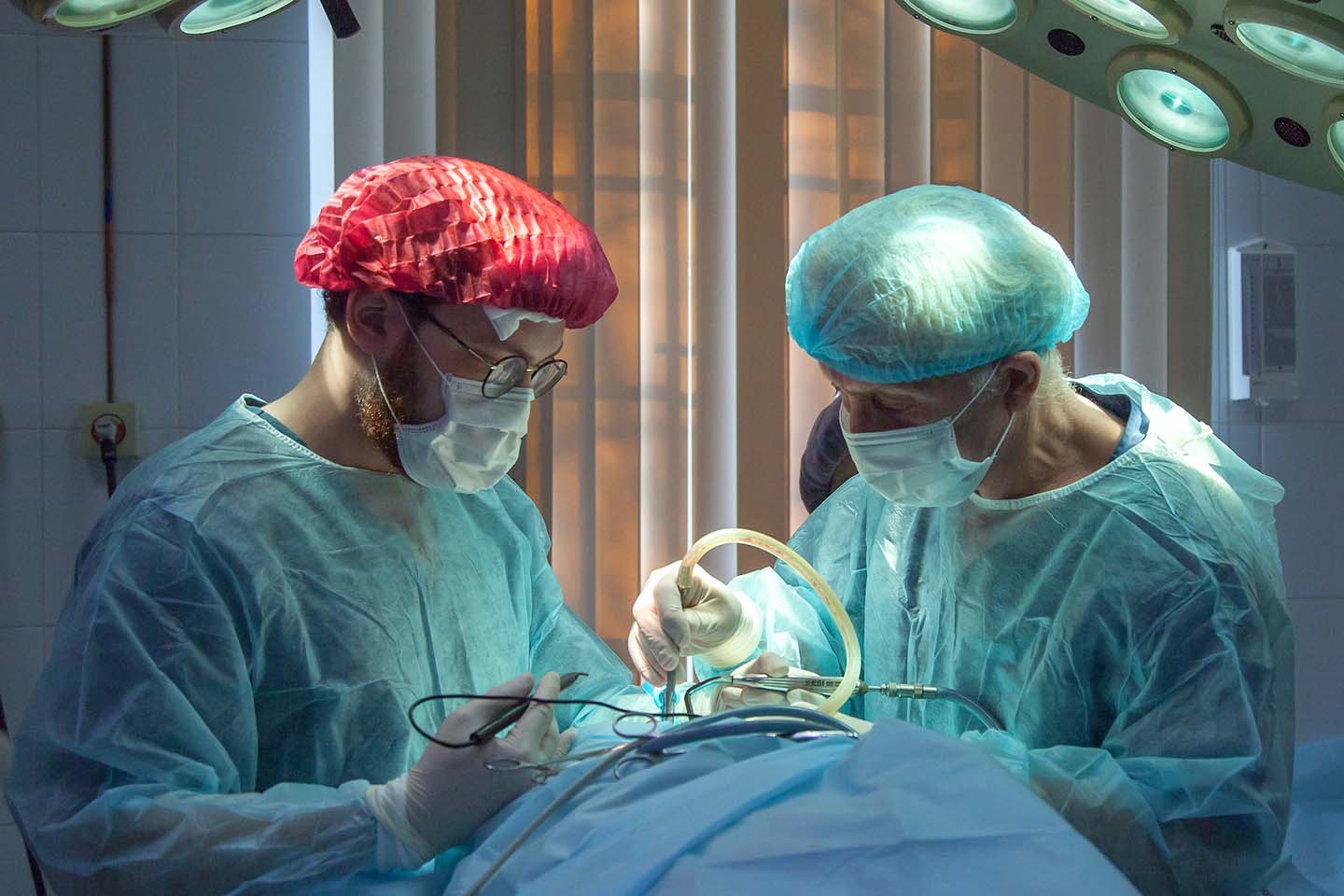 two surgeons performing a surgical operation