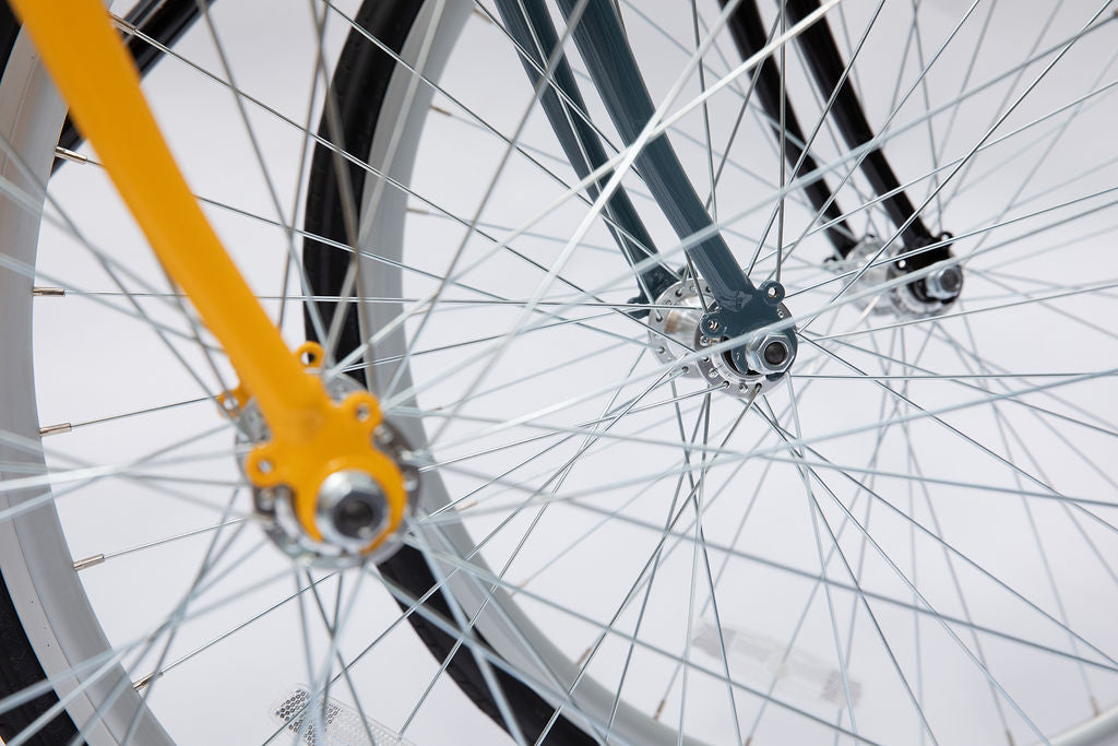 close up of three Single speed bike front wheels 