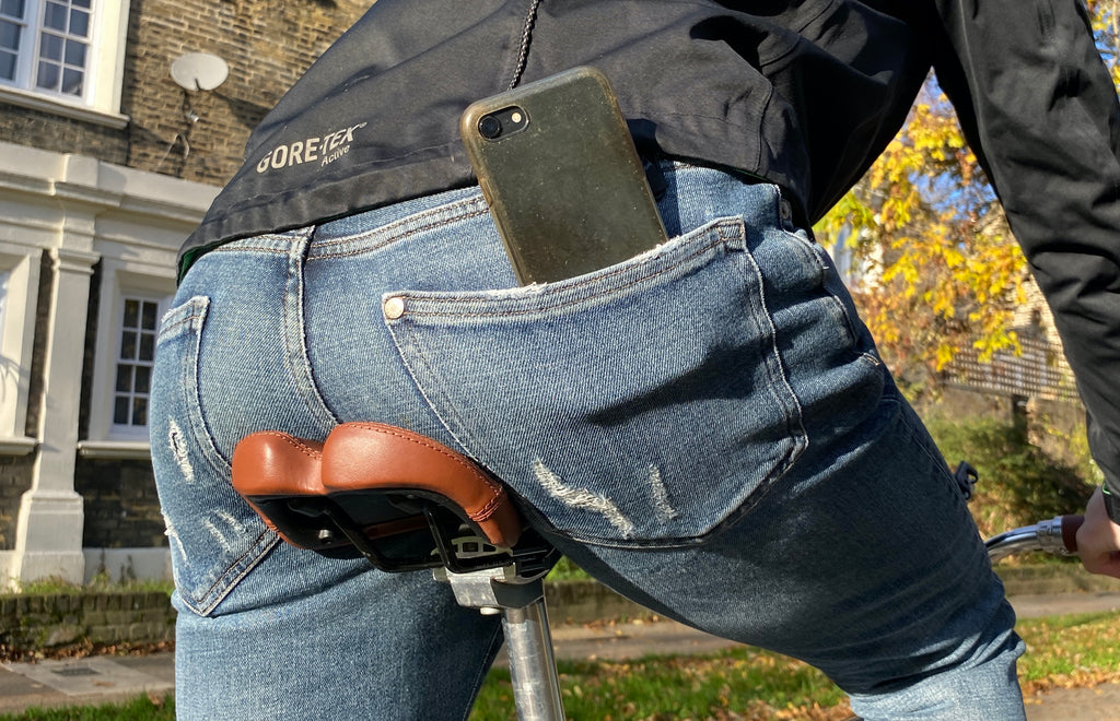 mobile phone falling out of back pocket of cyclist on a single speed Steed Bike 