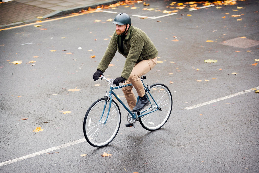 Man on Atlantic blue steed bike cycling in the rain
