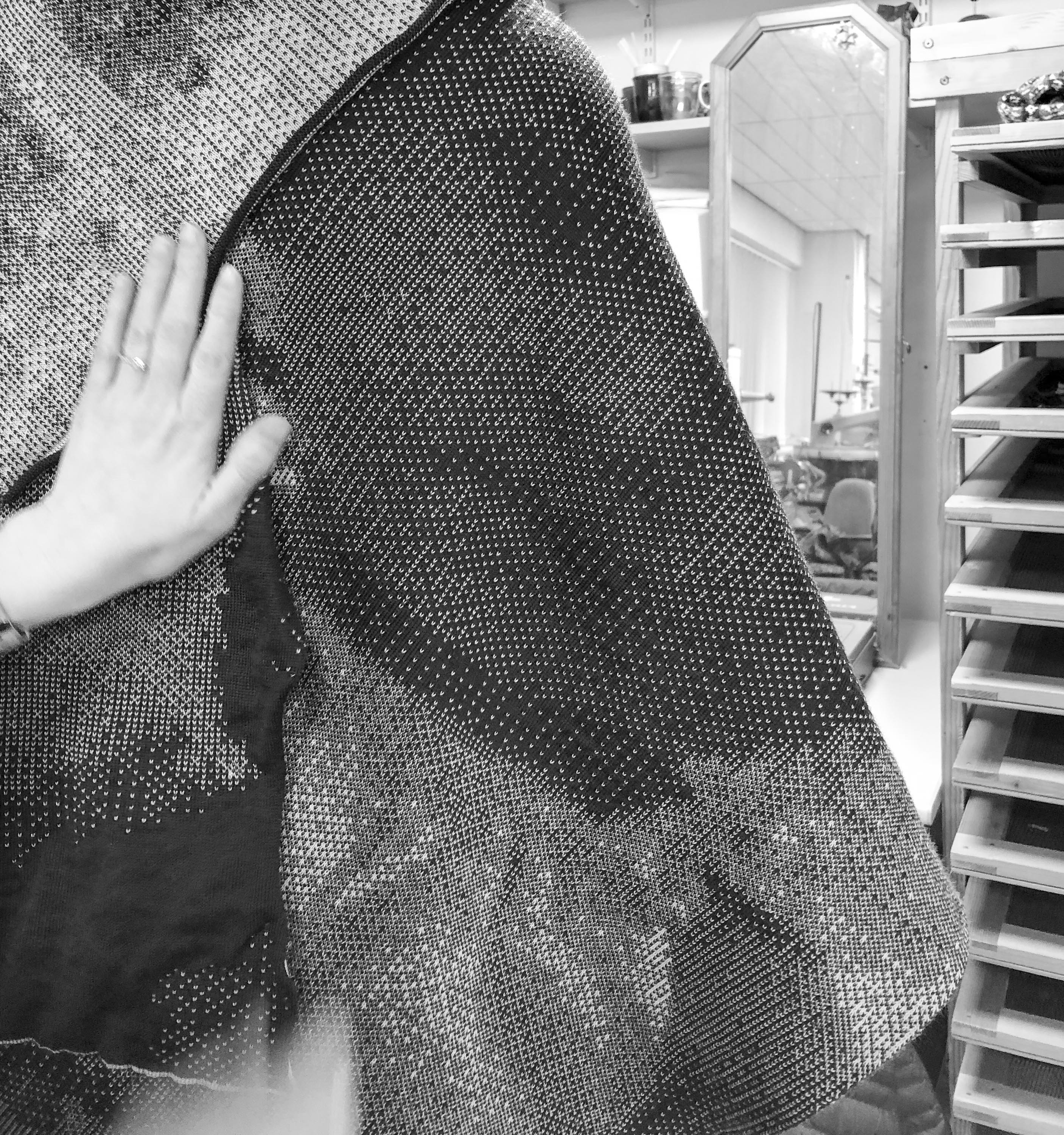 A prototype piece of Rani knitwear in the knitting room, experimenting with pattern and layout of photographs