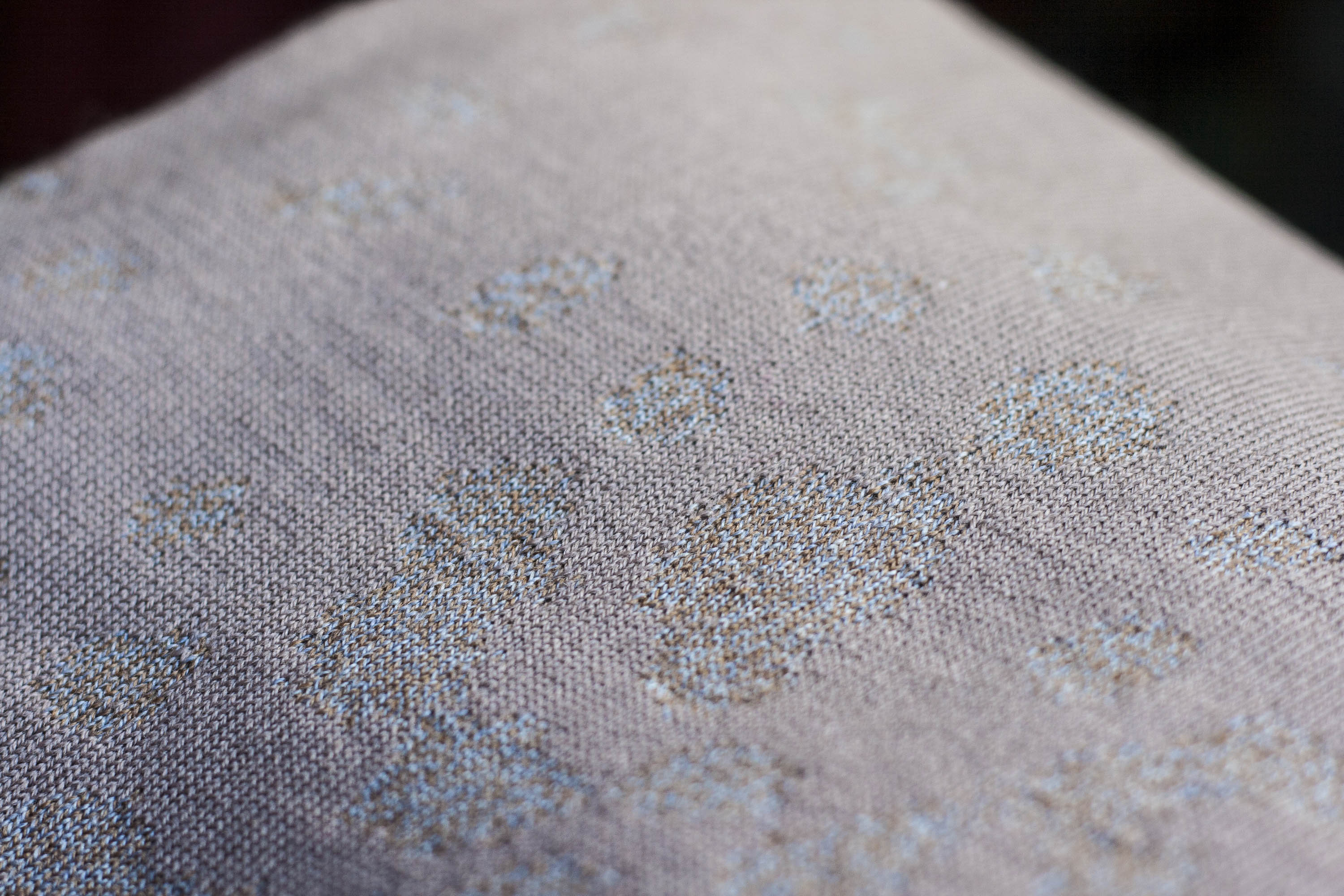 Detail of marlet knitted textile. Very subtle mottled pattern through choice of two close yarns in warm greys