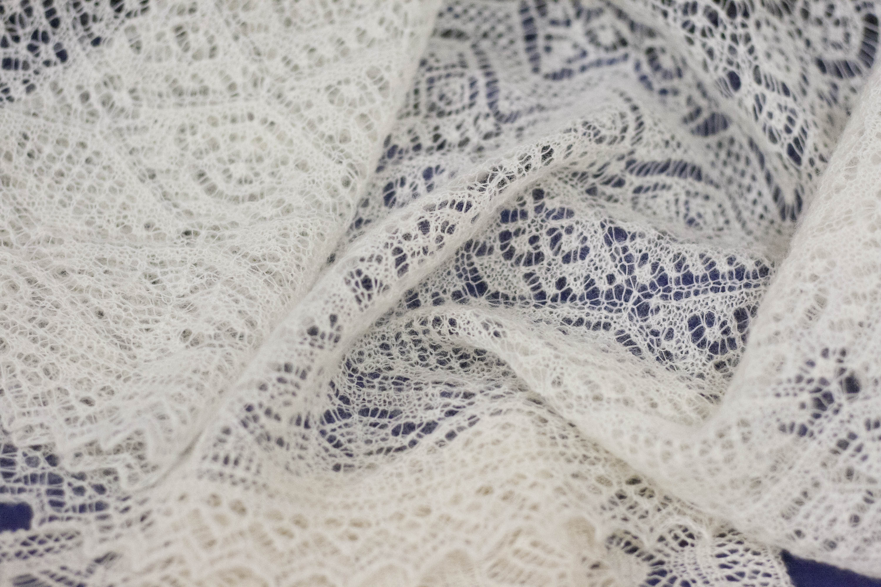 Fine traditional Shetland lace shawl in undyed natural white Shetland yarn