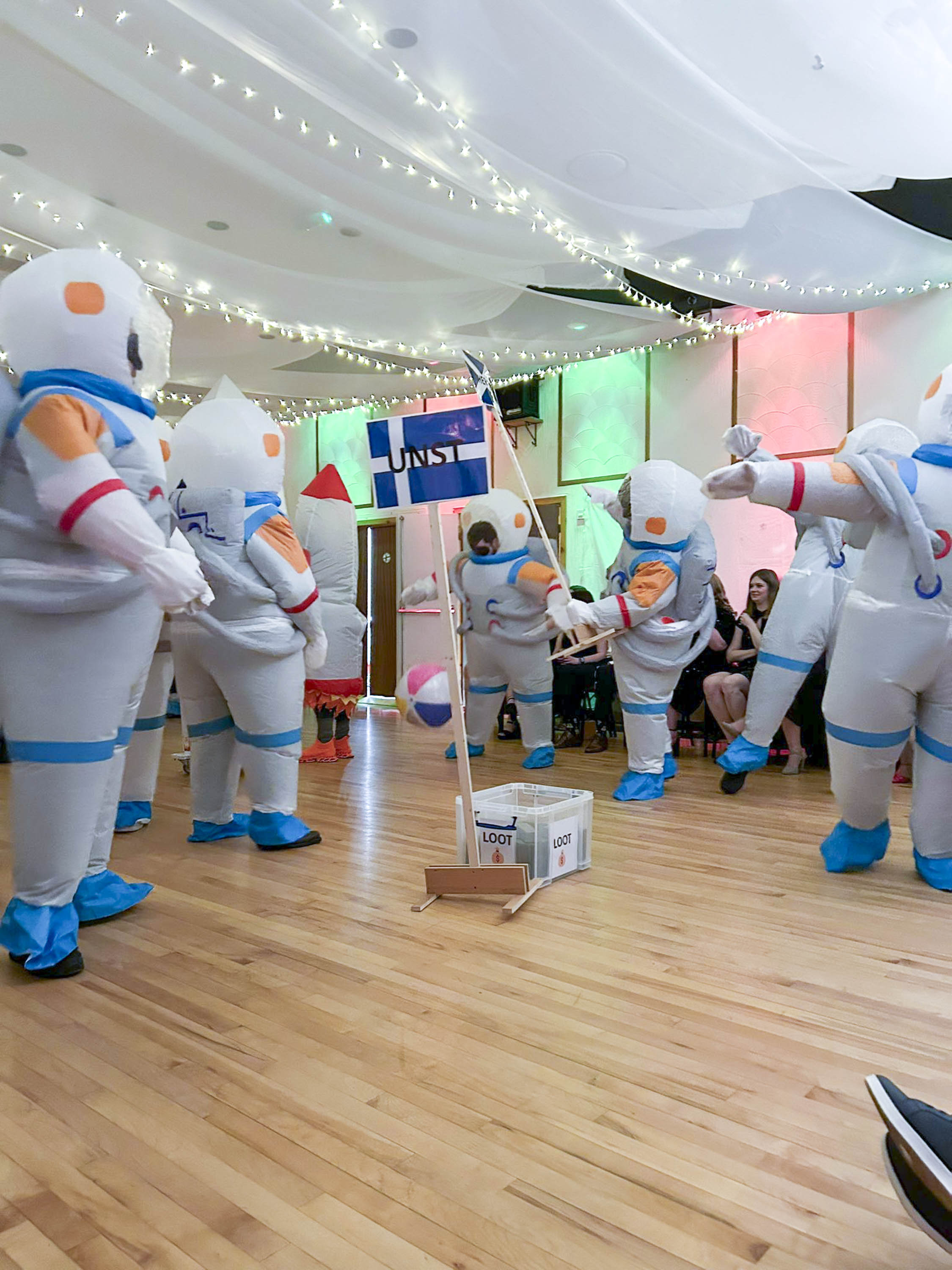 Guizers at Sandwick Hall, during South Mainland Up Helly Aa. Wearing astronaut costumes, the guizers perform a satirical skit.