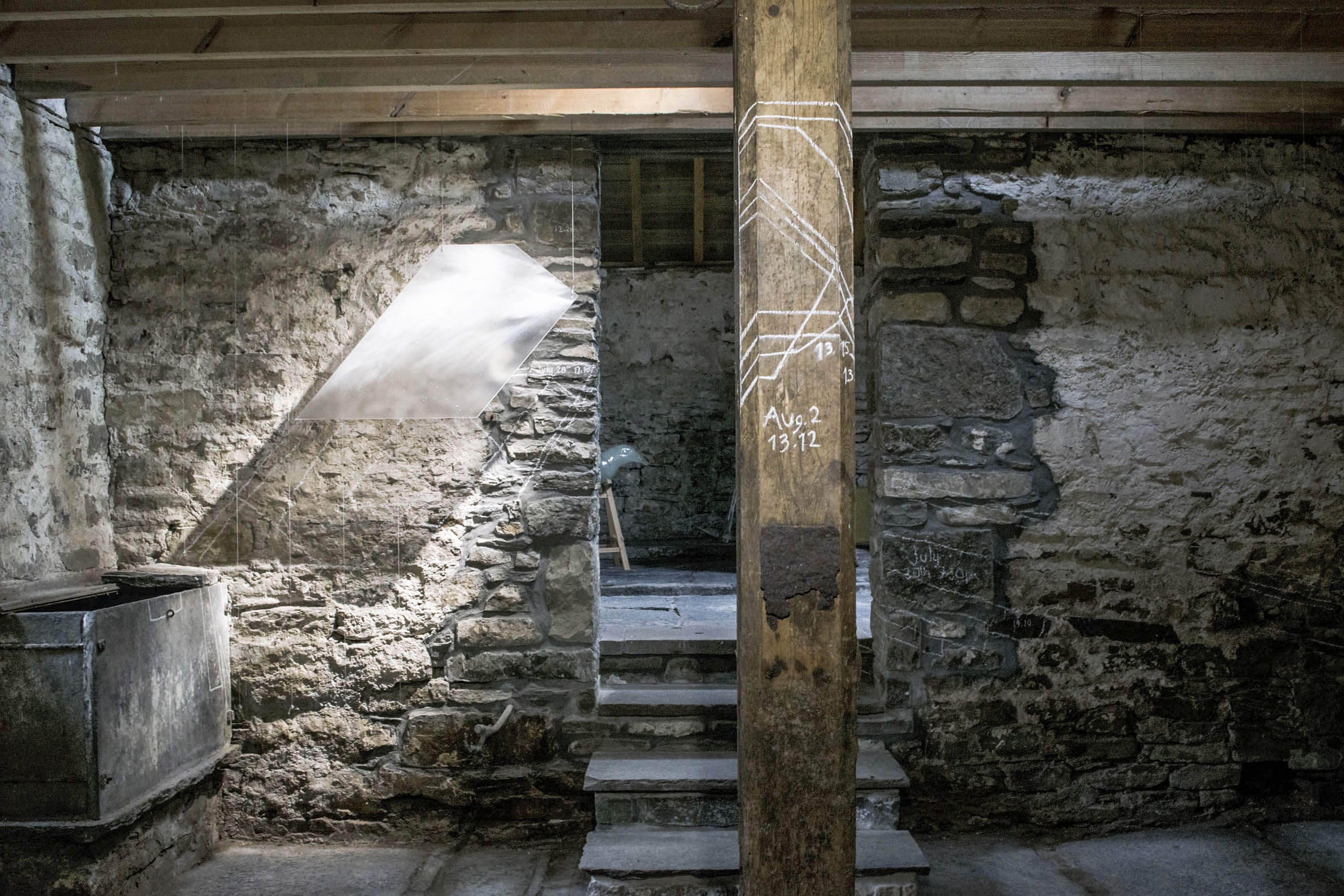 Installation by Karlyn Sutherland of glass panels tracking the shapes of light falling into the Byre at Latheronwheel, Caithness