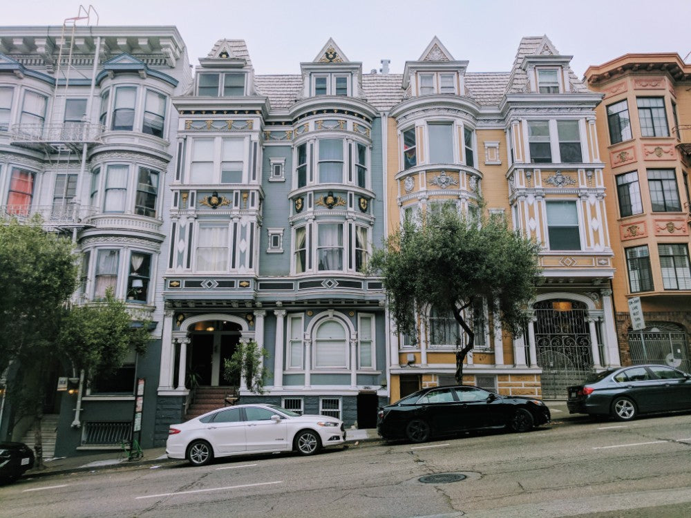 A row of San Francisco Victorian homes on a cloudy day