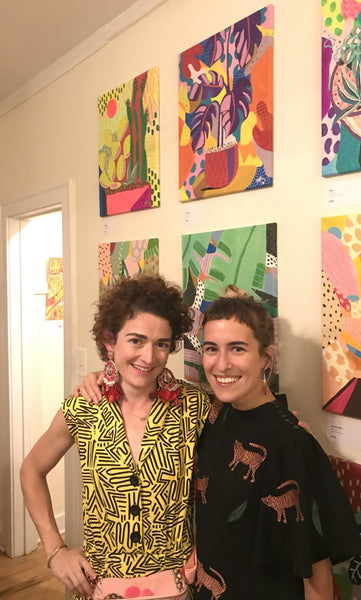The artist poses with one of her sister