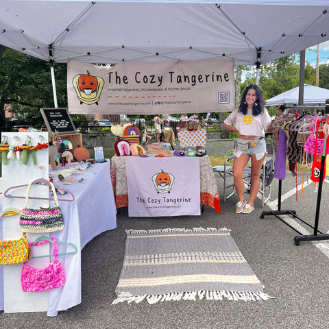 Jocelyn at her booth the cozy tangerine