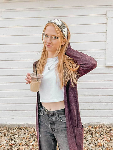 Girl posing wearing a crochet granny square headband