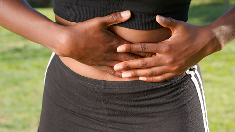 A woman holding her stomach