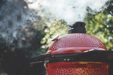 Kamado Joe grill smoking outdoors