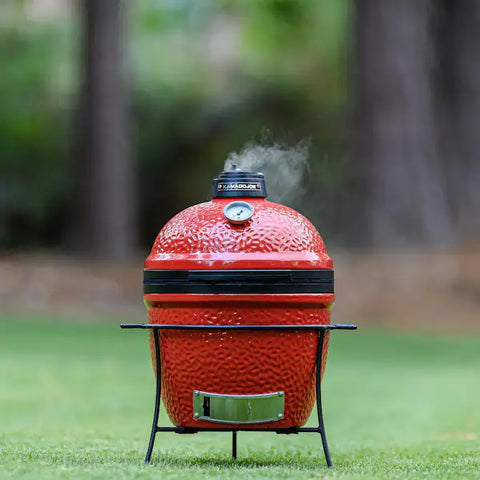 The kamado Joe Junior ready to grill in a park