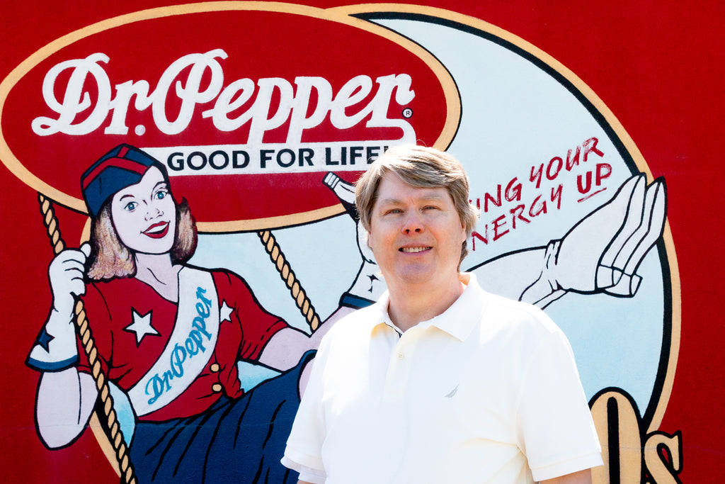 Author in front of Dr Pepper Mural