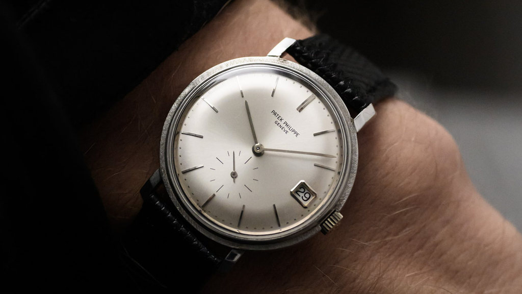 Wristshot of a vintage 1960s Patek Philippe reference 3445 with date in white gold