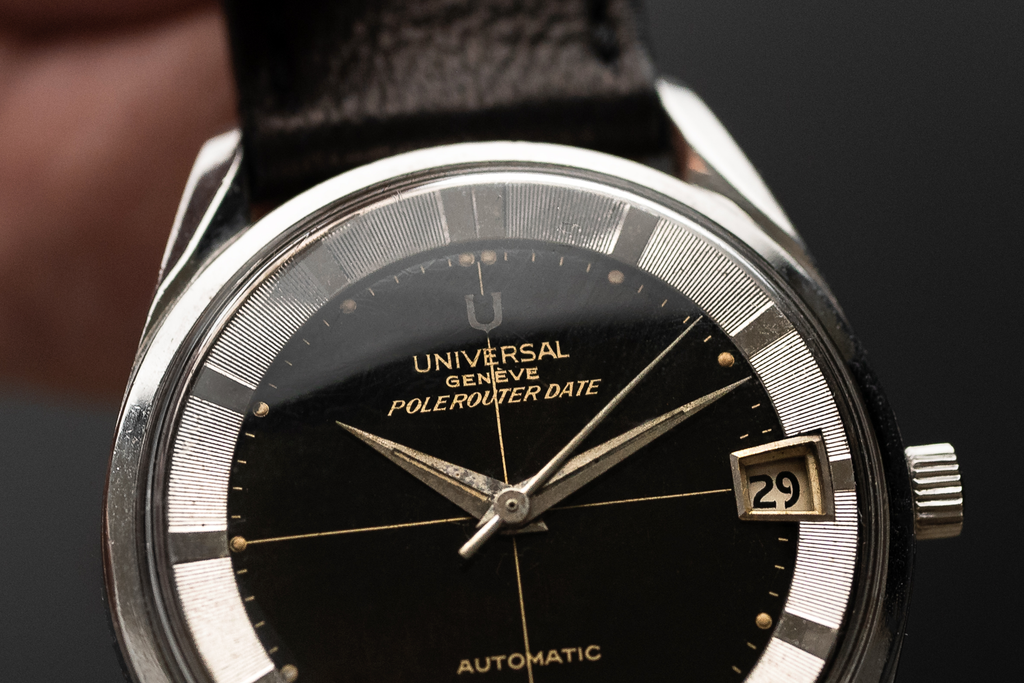 close up on a vintage 1960s Universal Geneve Polerouter with black dial