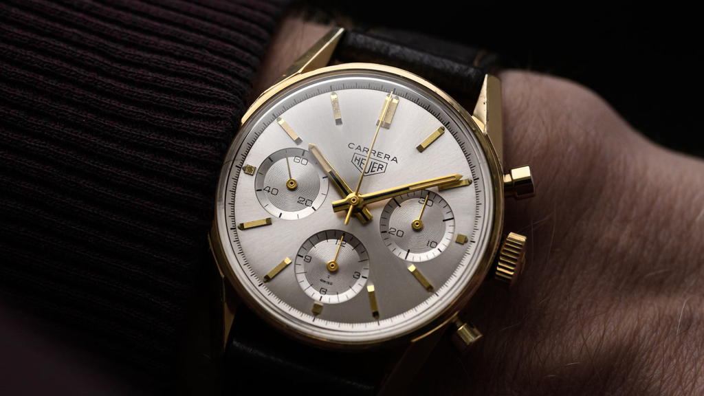 wristshot of an iconic gold-capped Heuer Carrera ref. 2448 chronograph from the 1960s
