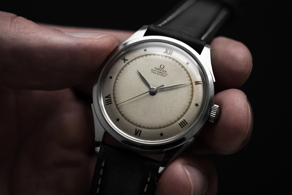 A Late Artdeco Omega in stainless steel with hammer automatic