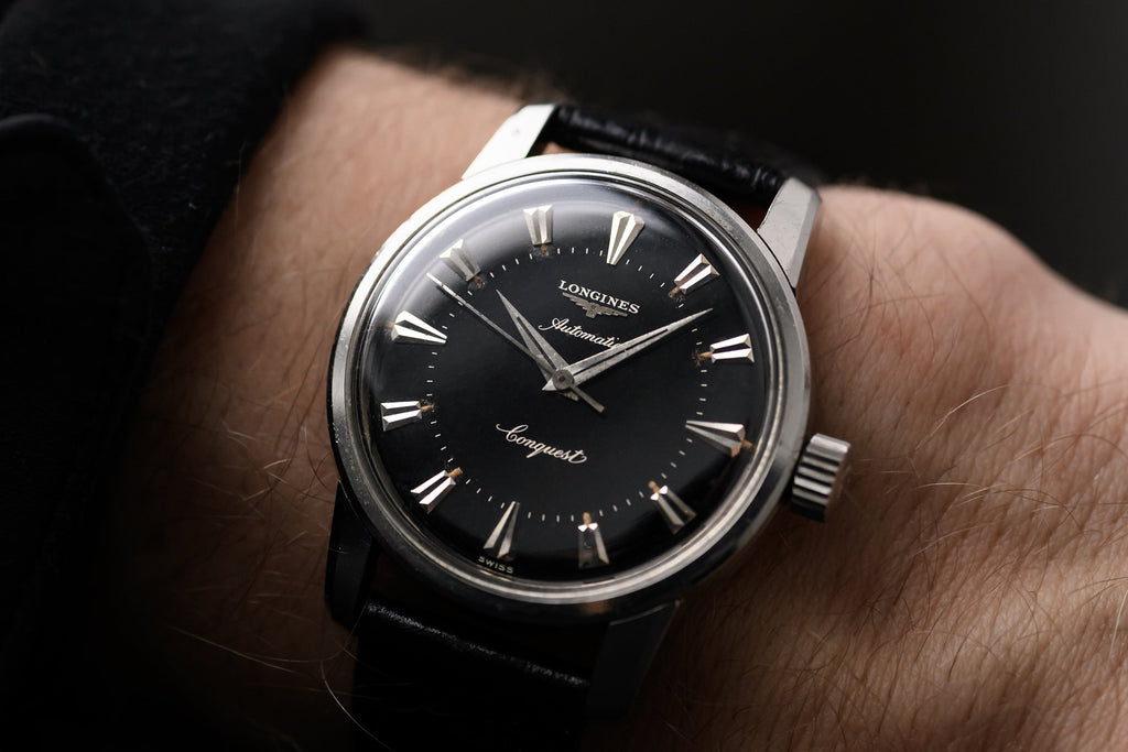 stunning vintage 1950s Longines Conquest with black dial