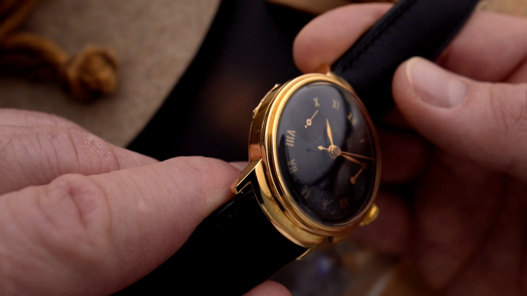 Side view on a rare 18k golden Eberhard chronograph with hinged case-back