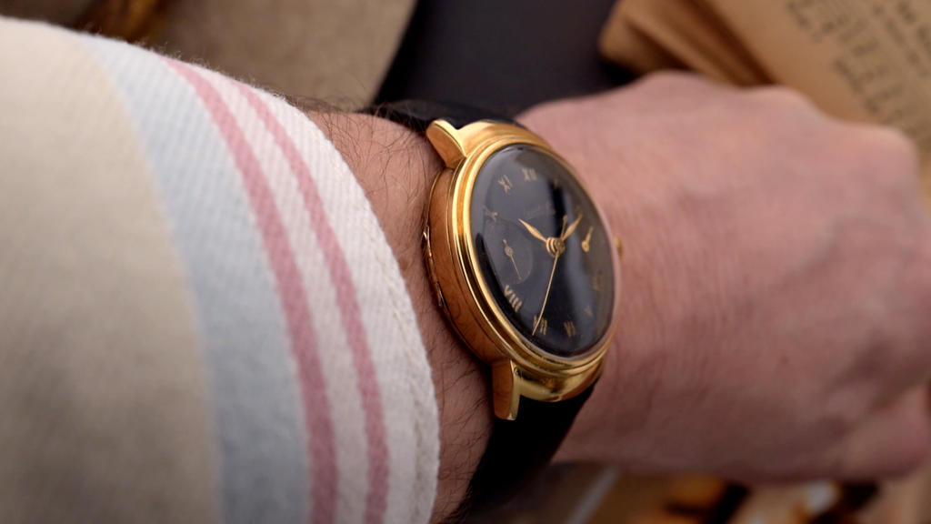 Wrist shot of a 1940s Eberhard chronograph with hinged case-back