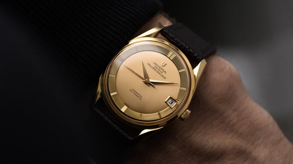 wristshot of a vintage 1960s Universal Geneve Polerouter in yellow gold