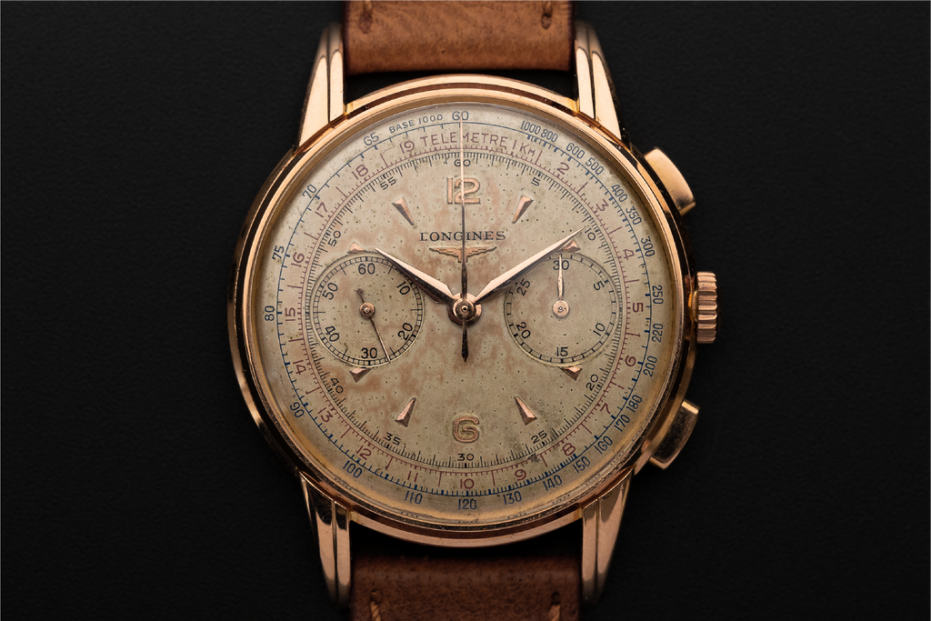 a rare and stunning vintage Omega Chronograph with stepped lugs and tachymeter scale on the dial