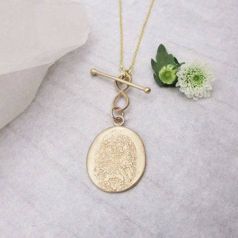 Organic looking gold fingerprint necklace from digital image