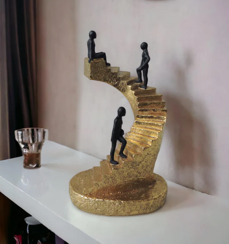 men walking on stairs and one sitting on top of the stairs