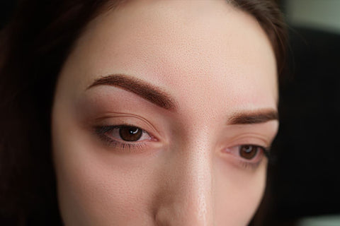 a red and swollen brow area after powder brow procedure