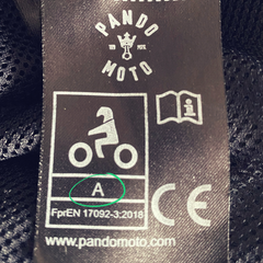 Label with CE certification on Pando Moto motorcycle jacket
