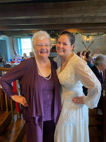 Grandmother of the Bride and Bride smiling together at wedding