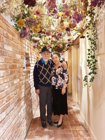 Couple in formal wear standing in a beautiful alley