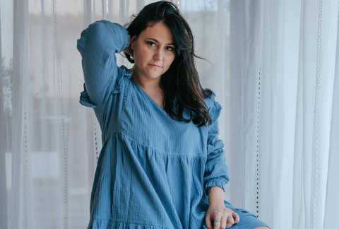 Model wearing nursing dress in jeans blue colors