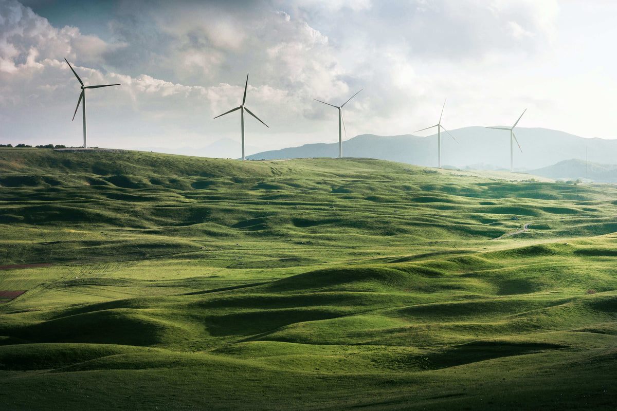 Renewable and Sustainable Energy Wind farm with multiple Wind Turbines set across a hillside