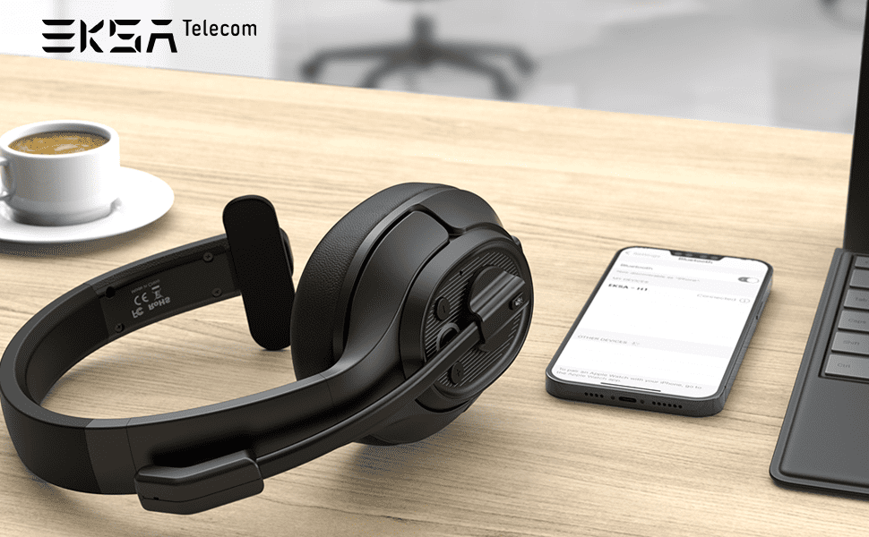 EKSAtelecom H1 headset, mobile phone and coffee on wooden table