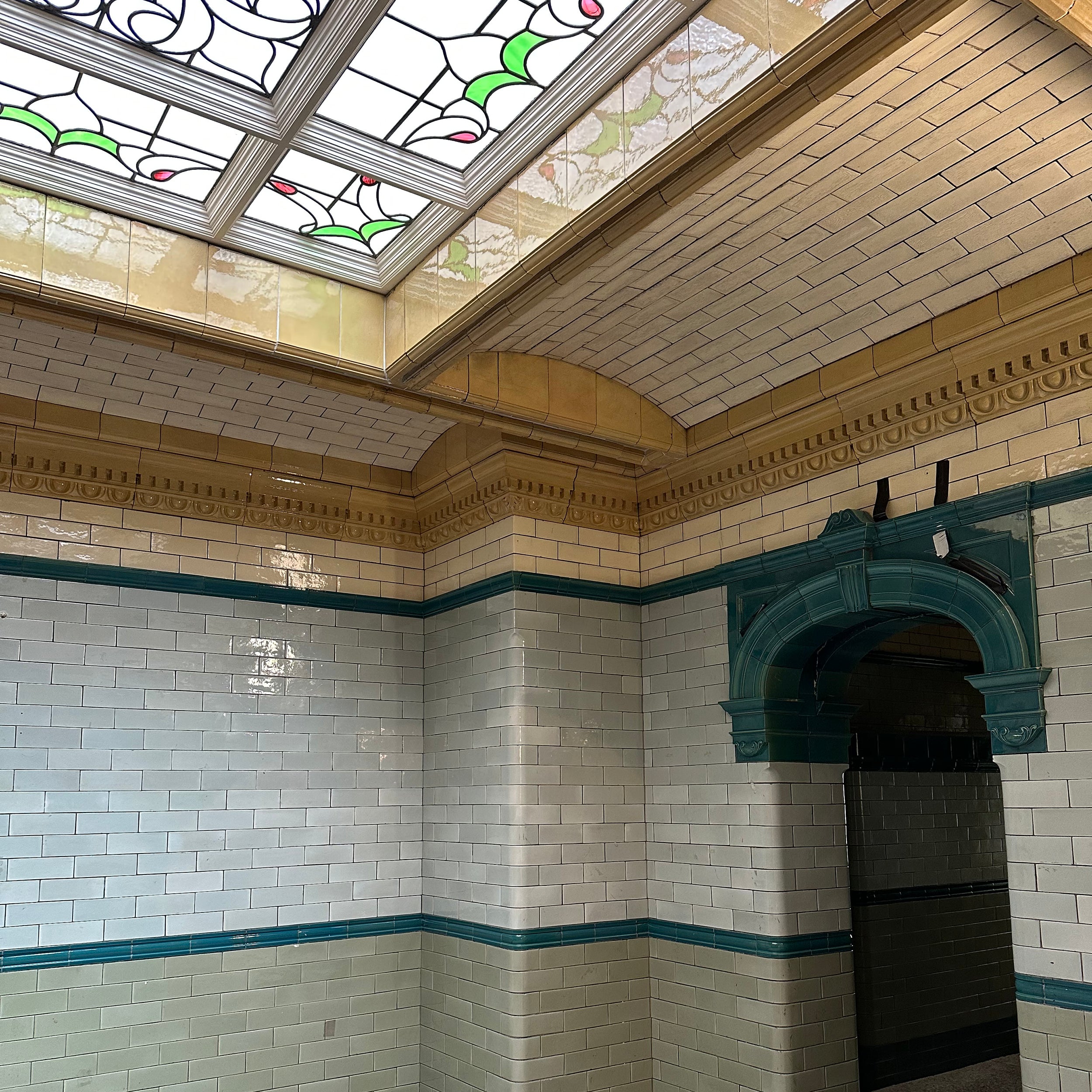 Beautiful tiling and a stained glass window in the ceiling