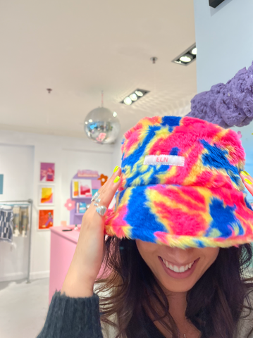 EVA WEARING MULTI BUCKET HAT WITH HEAD DOWN