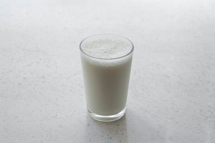 glass of milk on surface