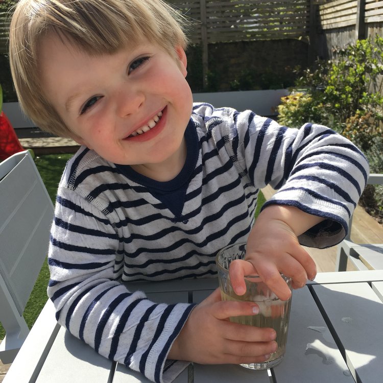 young boy with iced tea