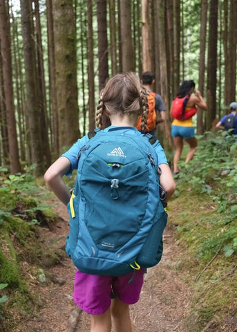 girl on walk with backpack