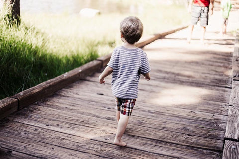 boy walking barefoot