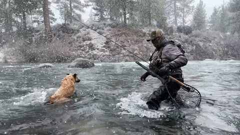 JEFF SASAKI AND HIS FOUR-LEGGED PAL, WINSTON THE AMAZING K9, BRAVE THE SNOW TO GET IN SOME CASTS ON THE TRUCKEE RIVER, PHOTO COURTESY MAVRK