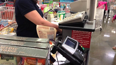 man checking out at teller